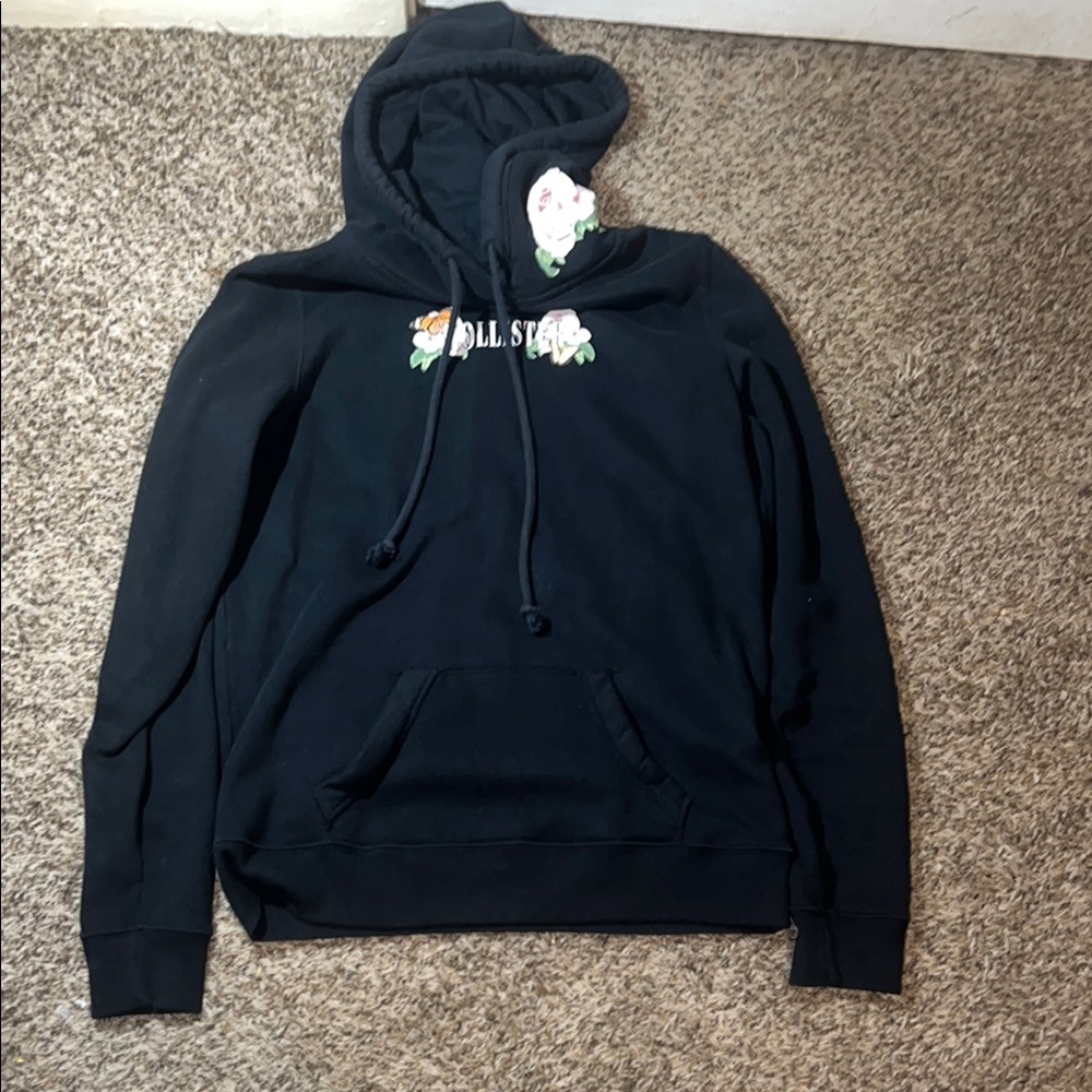 Woman’s Hollister sweatshirt with flower detailing size women’s Medium